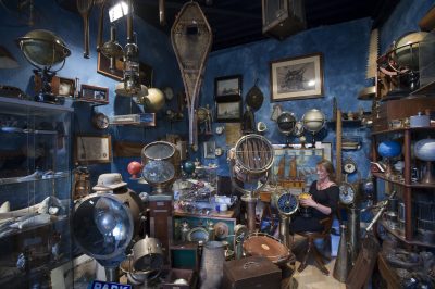 Vintage travel gear seller at the marche Dauphine, Paris